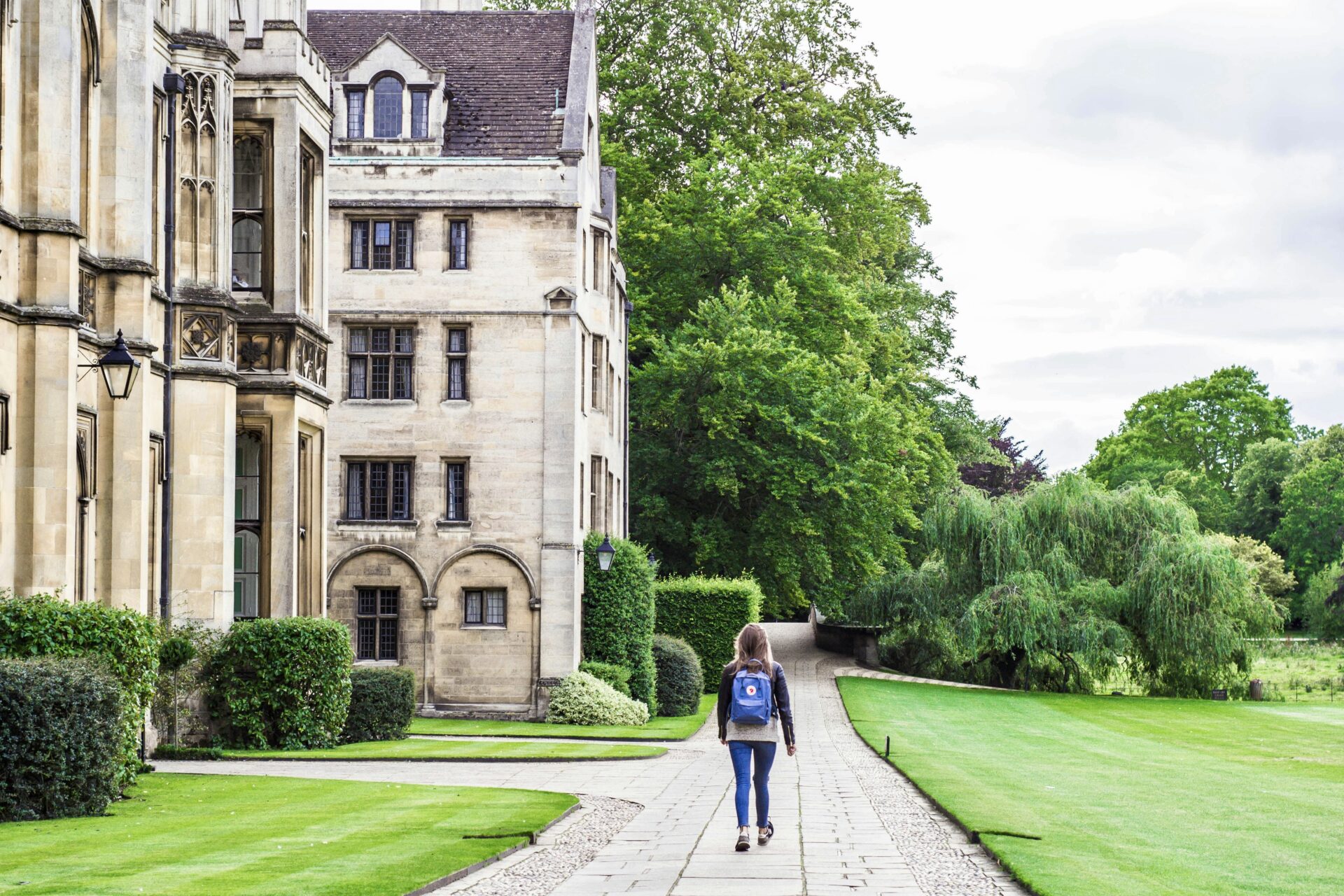 Person walking with backpaack at a university