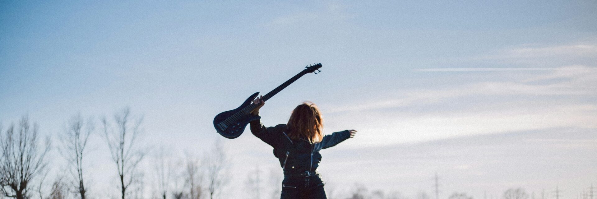 Person with guitar in air