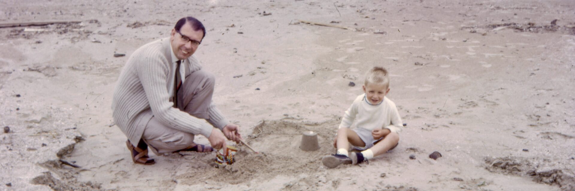 Father and son on beach