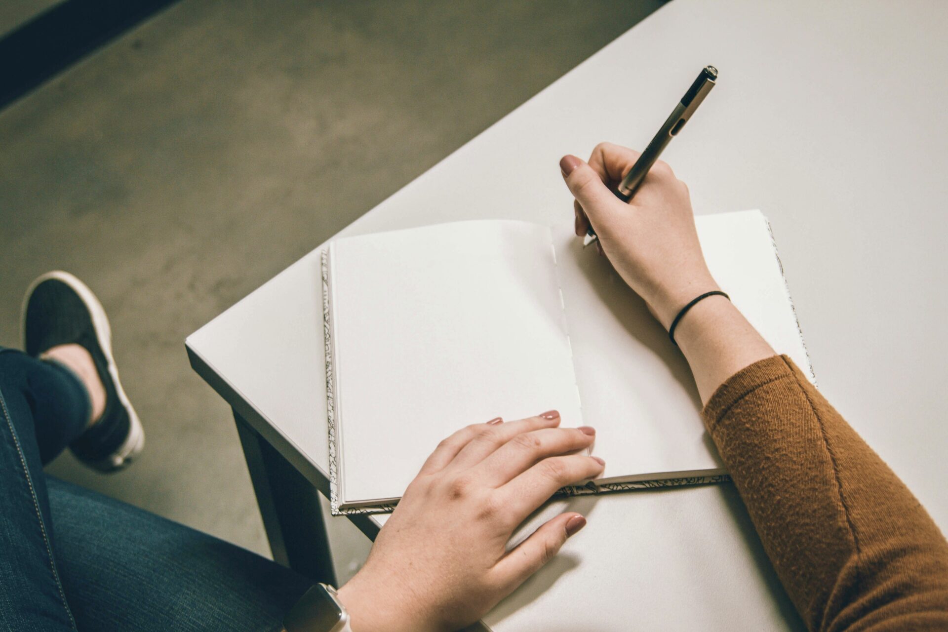 Person writing a aletter