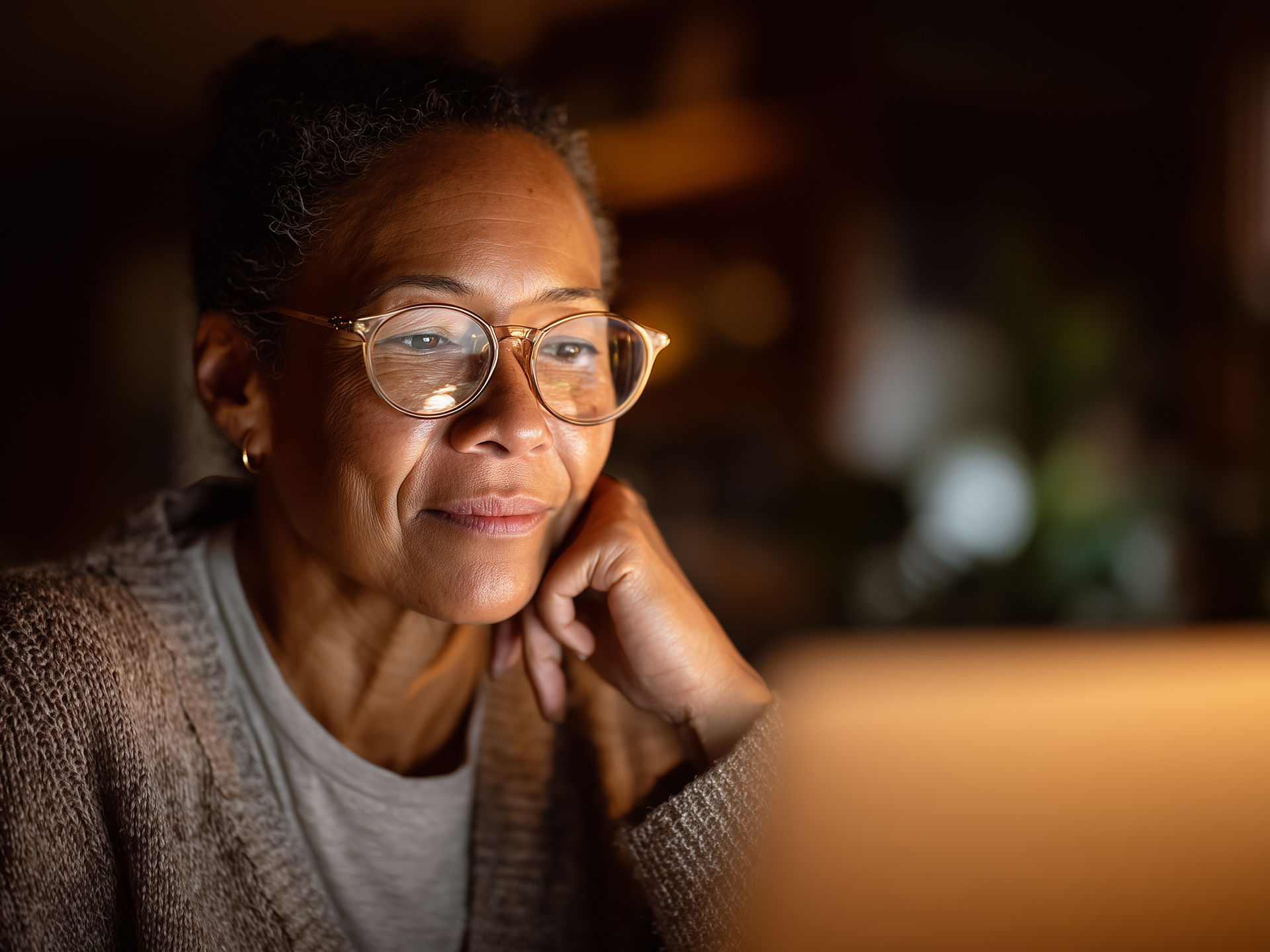 Middle aged woman looking at computer